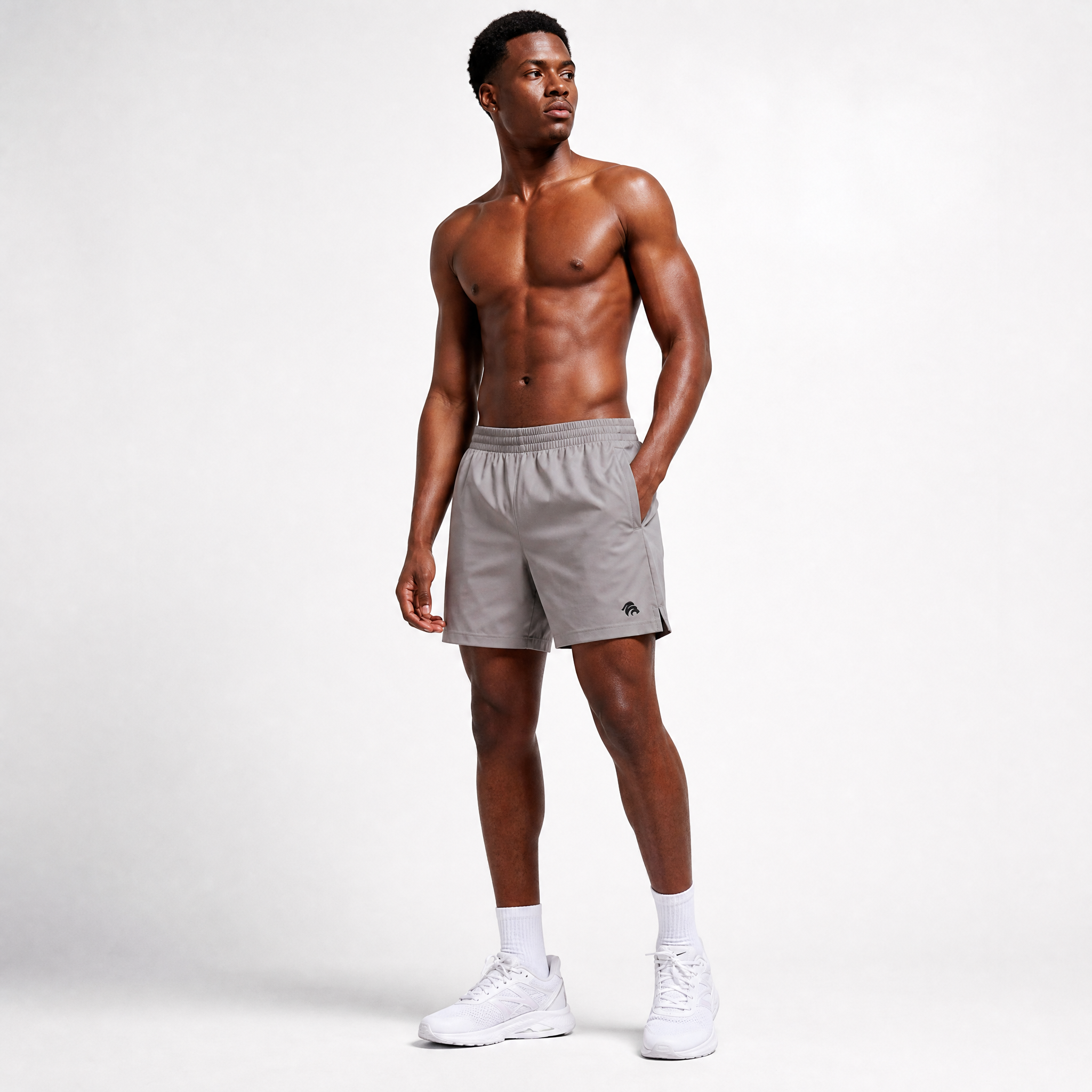 Generated_with_Kive.ai_-_can_you_have_a_young_athletic_black_man_modeling_these_shorts_shirtless_for_an_activewear_brand_in_a_white_backgroung_studio_that_s_a_high_professional_photo.png