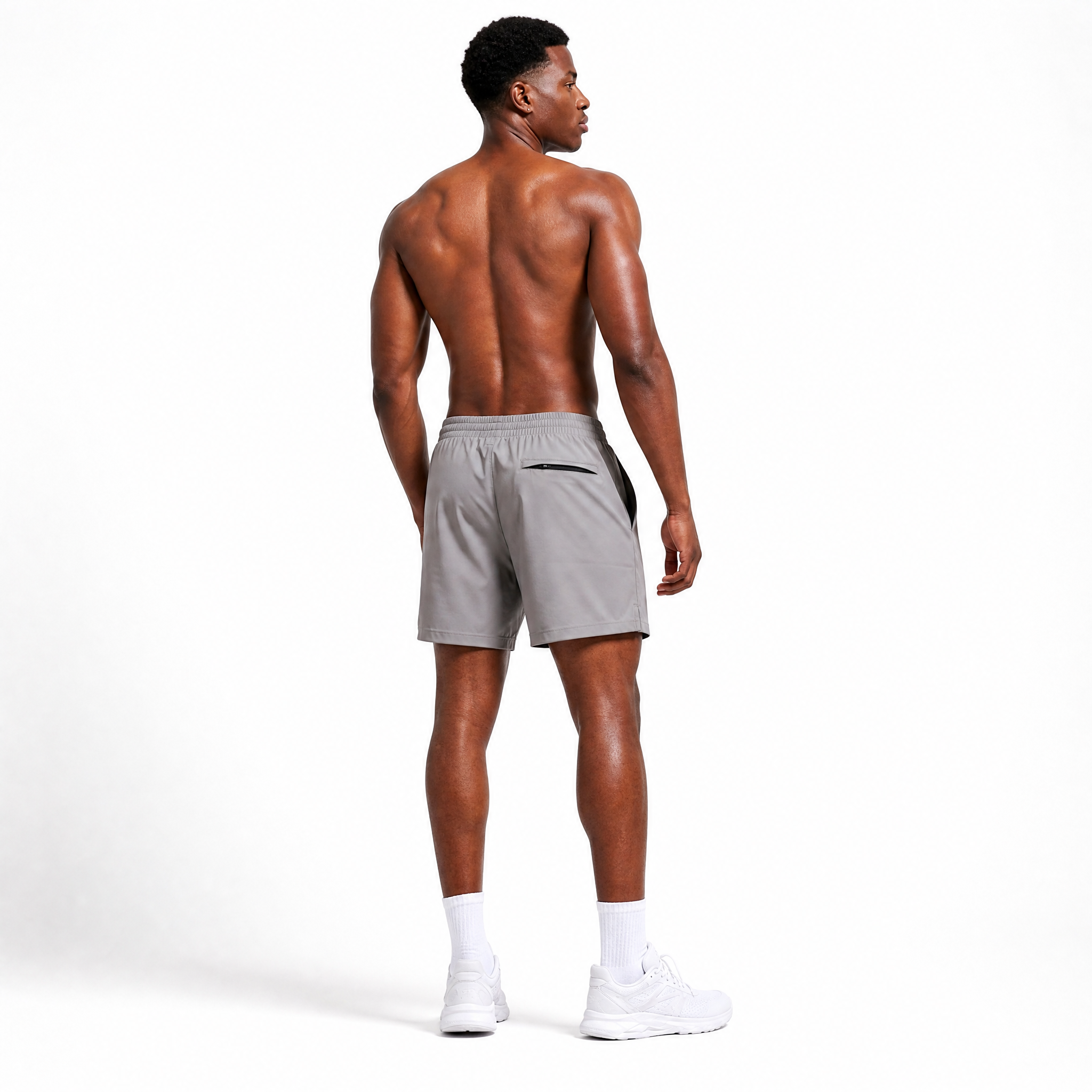 Generated_with_Kive.ai_-_can_you_have_this_man_modeling_these_shorts_shirtless_for_an_activewear_brand_in_a_white_backgroung_studio_that_s_a_high_professional_photo_shoot_in_a_back_an.png