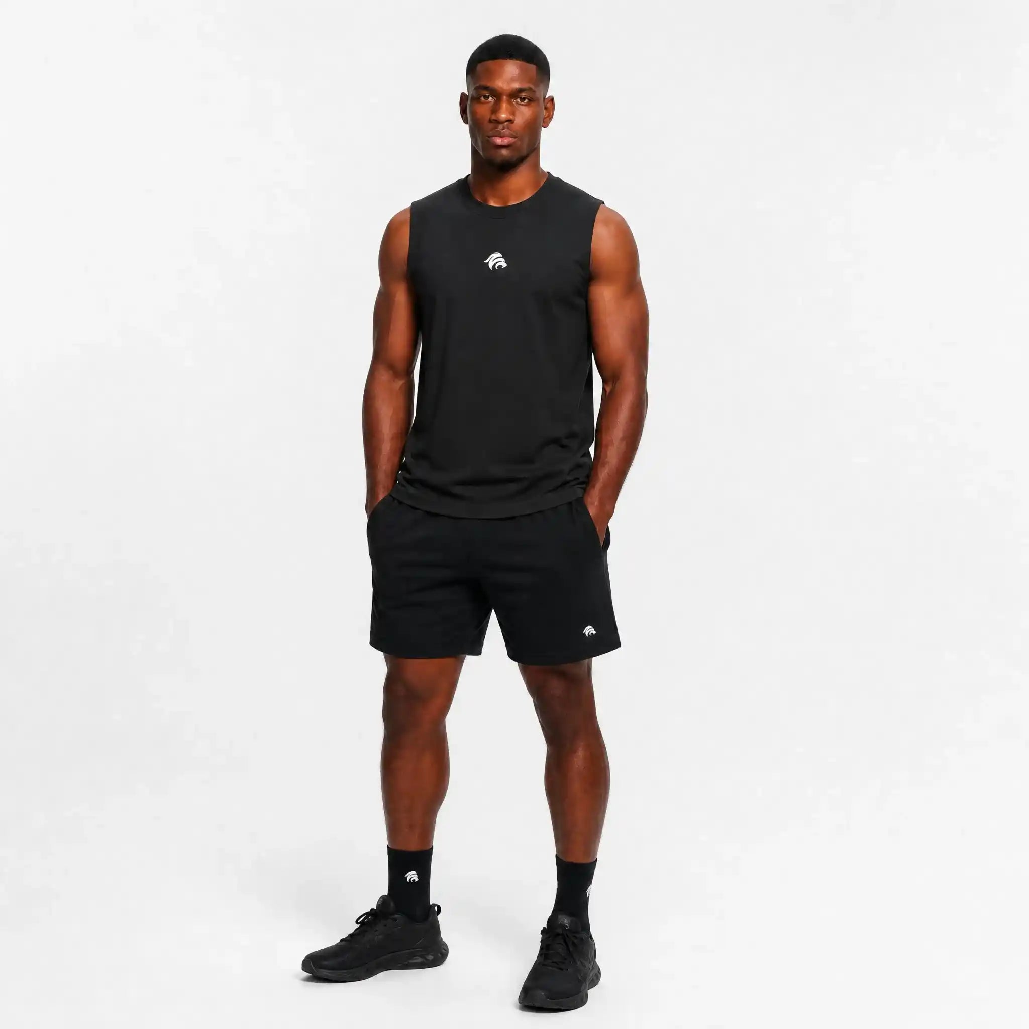 Generated_with_Kive.ai_-_can_you_just_have_this_man_model_this_black_tank_top_for_an_activewear_brand_in_a_white_backgroung_studio_that_s_a_high_professional_photo_shoot_8ca61ff0-5851-4aac-b7a1-e107da0b4060.webp