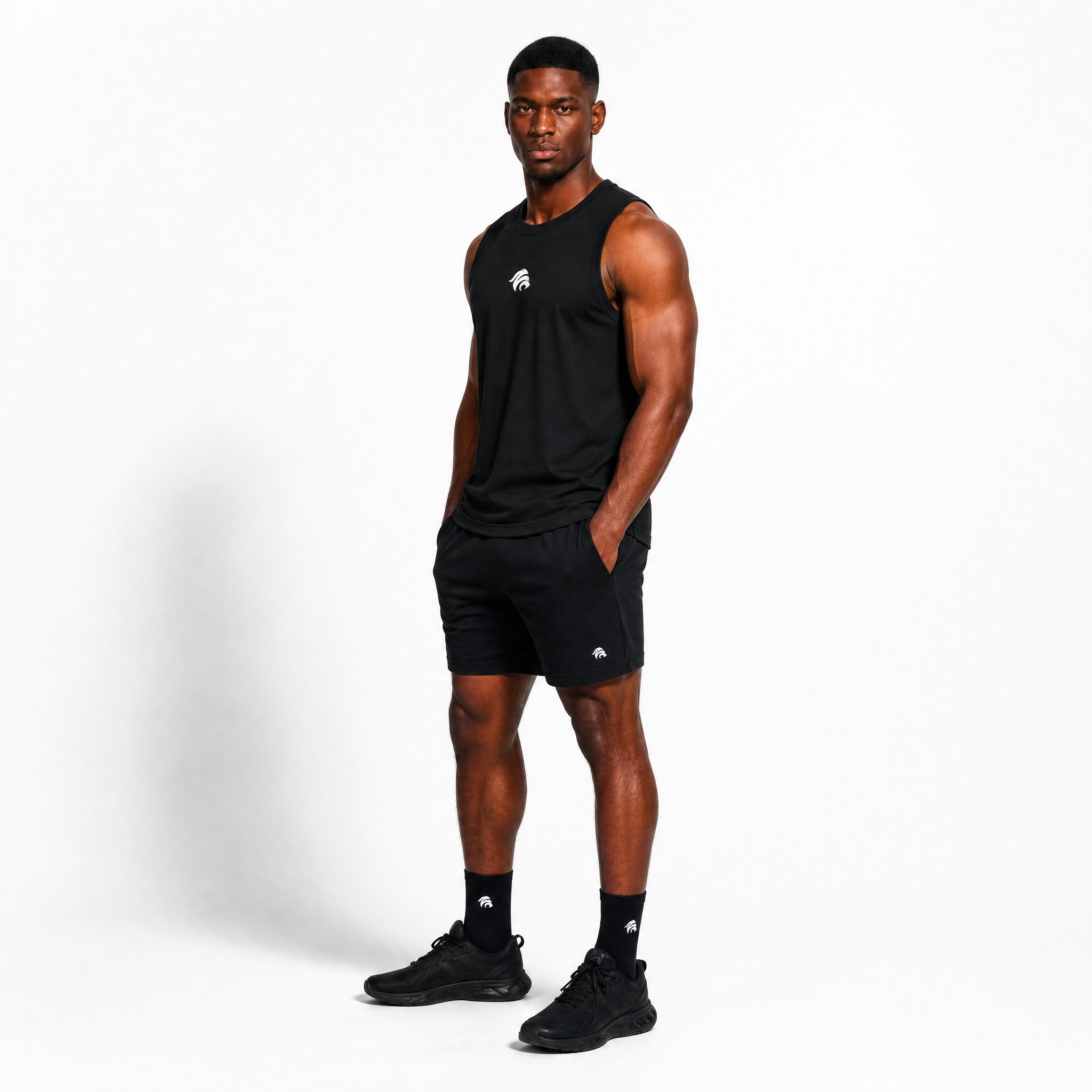 Generated_with_Kive.ai_-_can_you_just_have_this_man_model_this_black_tank_top_for_an_activewear_brand_in_a_white_backgroung_studio_that_s_a_high_professional_photo_shoot_at_a_side_ang.png